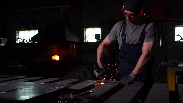 Industrial Engineer Working on Cutting Steel with Compound Mitre Saw