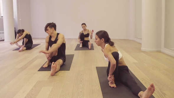 Yoga Class. People Doing Yoga Asanas