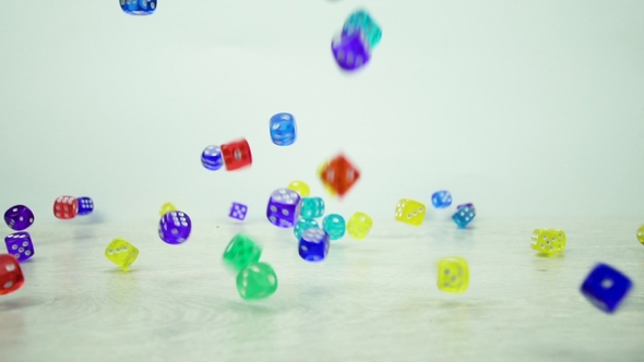 Shot of Multicolored Dice Fall on a White Background
