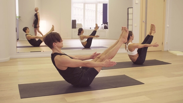 People Doing Yoga Asanas on Yoga Class