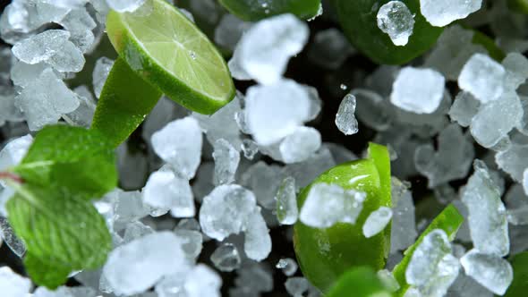 Super Slow Motion Shot of Exploding Crushed Ice Lime and Mint Towards Camera at 1000Fps