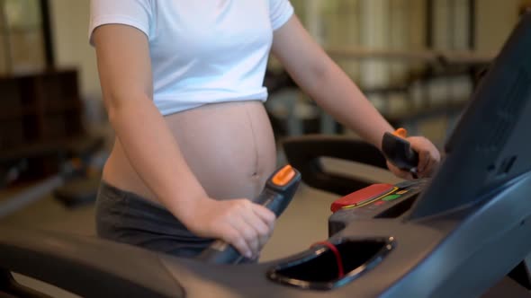 Active Pregnant Woman Exercise in Fitness Center