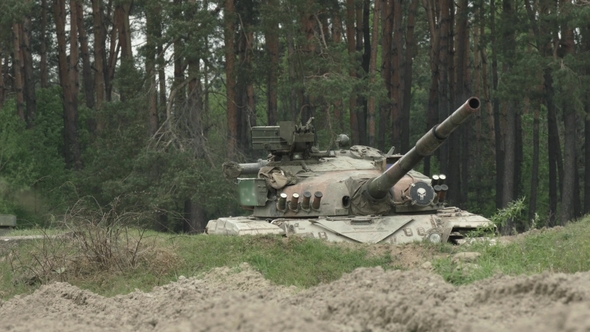 Military Tank Shoots On The Target