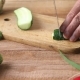 Top Shot of Man Chef Cutting Cucumber on Chopping Board - VideoHive Item for Sale
