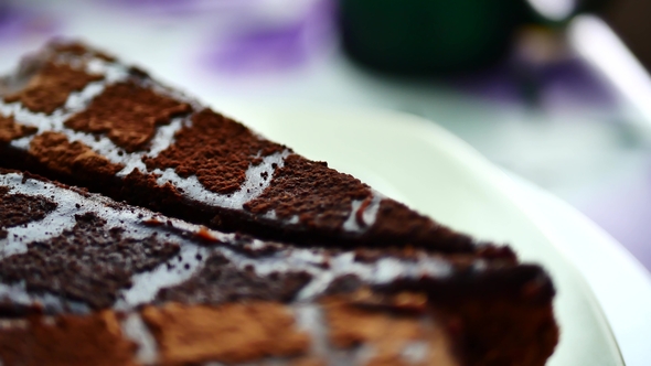 Sliced Tasty Chocolate Cake on Table Background