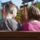 Boy and Girl Sitting on the Bench - VideoHive Item for Sale