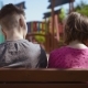 Boy and Girl Sitting on the Bench - VideoHive Item for Sale