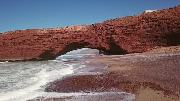 Flying Through Arch on Legzira Beach in Morocco
