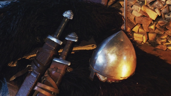 A  Viking Helmet and Two Swords in a Scabbard alt