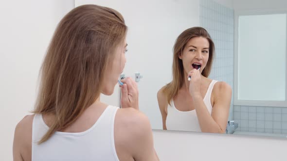 Woman Brushing Teeth