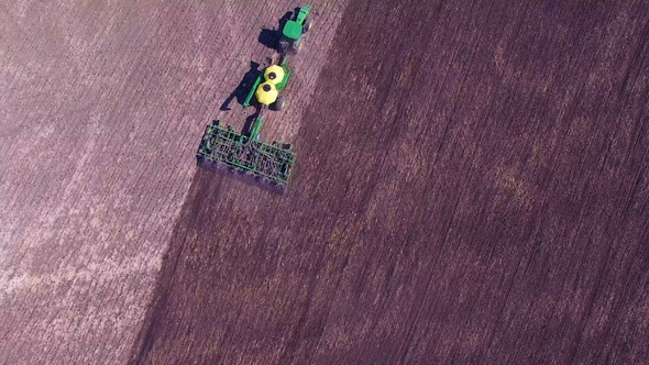 One Tractor Plows and Seeds, Top View