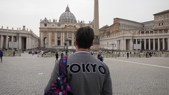 Young Man From Tokyo with Backpack in Vatican City and St. Peter's Basilica Church, Rome, Italy