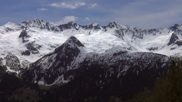 Louds Over Tops of Snow-capped Mountains in Alps