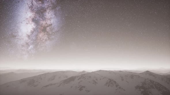 Milky Way Above Snow Covered Terrain alt