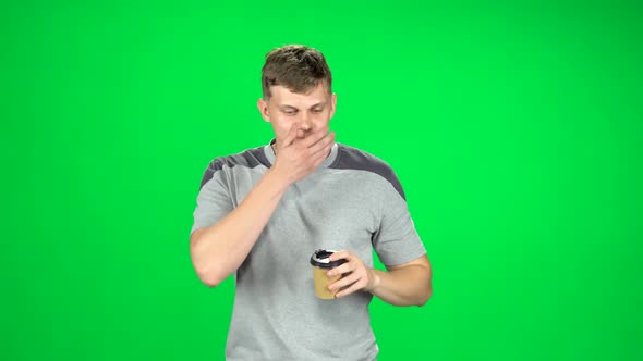 Guy Is Walking and Drinking Disgusting Coffee From a Paper Cup