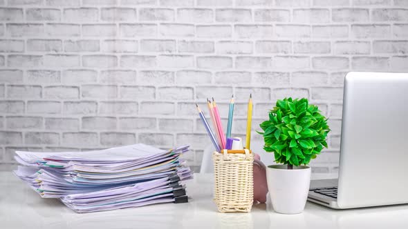 Stop motion animation, Stacks of business paper files on office desk, alt