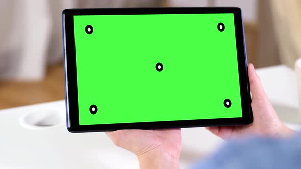 Hands Holding Tablet Pc with Green Screen at Home 110
