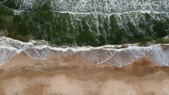 Drone Flight Over the Azure Sea with Waves and Sandy Coast