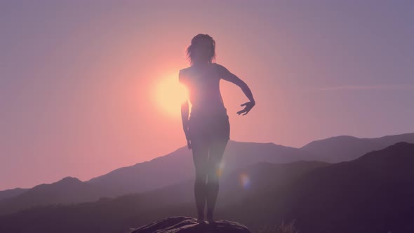 Women Dancing at the Mountain Silhouette