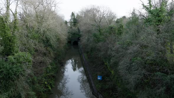 Grand Union Canal Cutting Shrewley Tunnel Entrance Warwickshire UK Aerial Slow Descend Winter Water