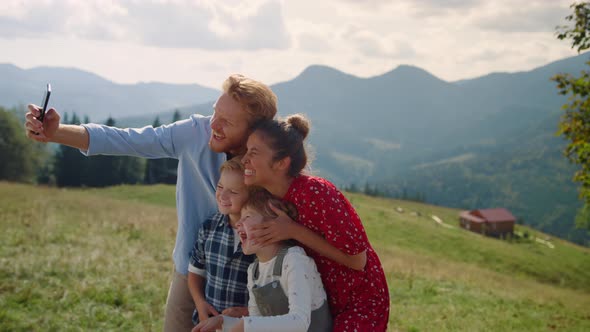 Funny Family Fooling Making Selfie on Mountains