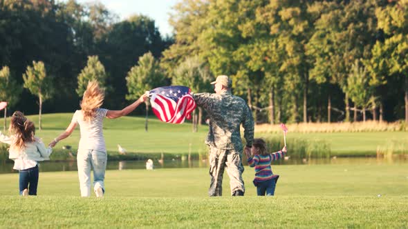 Back View Patriotic Family Running with Background.