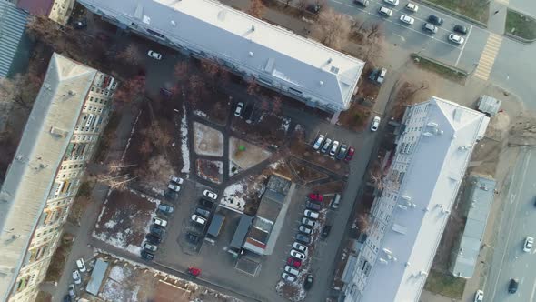 Yard with Playground Cars and High Dwelling Buildings