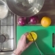 Chef Cutting an Orange on the Chopping Board - VideoHive Item for Sale