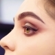 Makeup Artist Painting Black Eyeliner on the Eyes - VideoHive Item for Sale