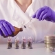 The Scientist's Hands Pouring Solvent Into the Bottles - VideoHive Item for Sale