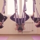 Group of People Doing Aerial Yoga Asanas in Gym - VideoHive Item for Sale