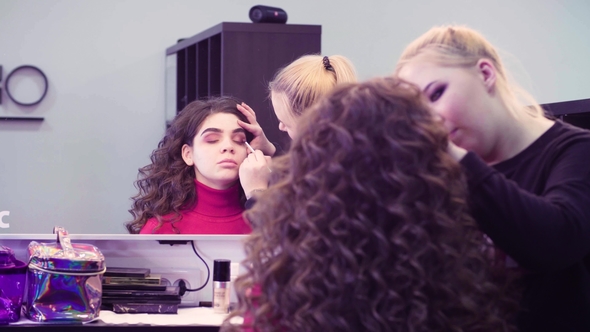 Makeup Artist Applying Eyeshadow