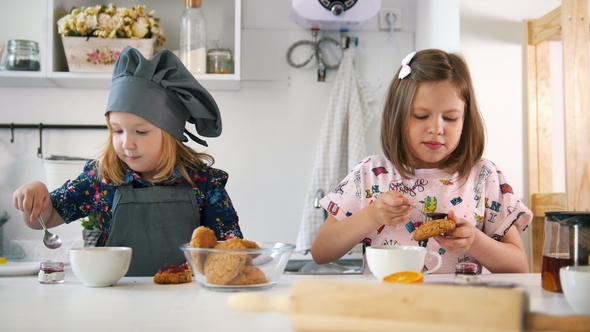 Group of Children Decorating Cookies with Jam