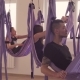 Group of People Doing Aerial Yoga Asanas in Gym - VideoHive Item for Sale
