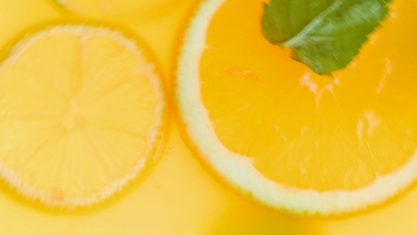 Video of Mixing and Making Lemonade with Fresh Oranges and Mint Leaves