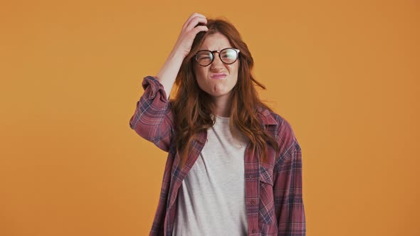 Ginger Teenage Model in Checkered Shirt and Glasses