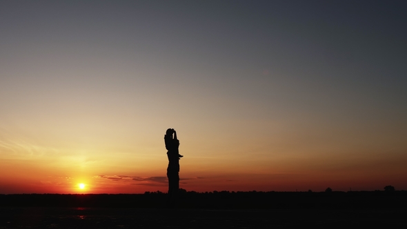 Father Playing with Little Son at Sunset