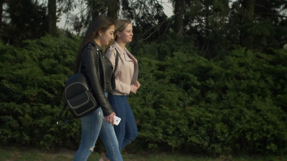 Happy Teenage Girls Enjoying Nature in Parkland