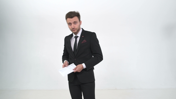 Businessman Holds Envelope on Camera