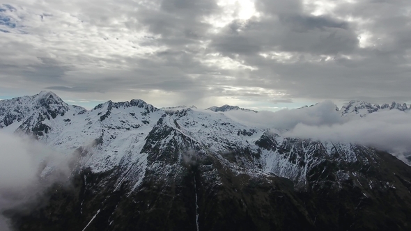 Snow-capped Mountains in Clouds