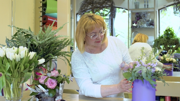 Adult Woman Look at Complete Flower Composition