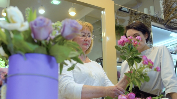 Assistant Learn To Create Flower Bouquet Under Supervision of Florist