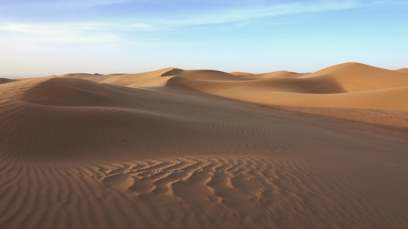 Sand Blowing over Dunes in Wind at Sahara Desert