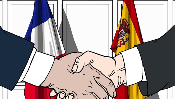Businessmen or Politicians Shaking Hands Against Flags of France and Spain alt