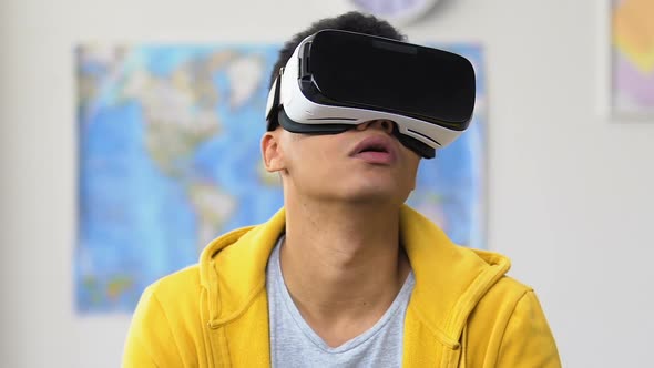 Afro-American Teenage Guy Using Virtual Reality Headset, Leisure Lifestyle