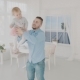 Father Swinging His Beautiful Daughter in the Room - VideoHive Item for Sale