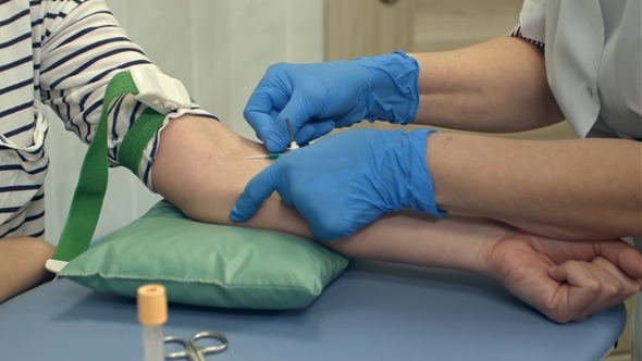 Nurse Collecting Blood From Patient Vein