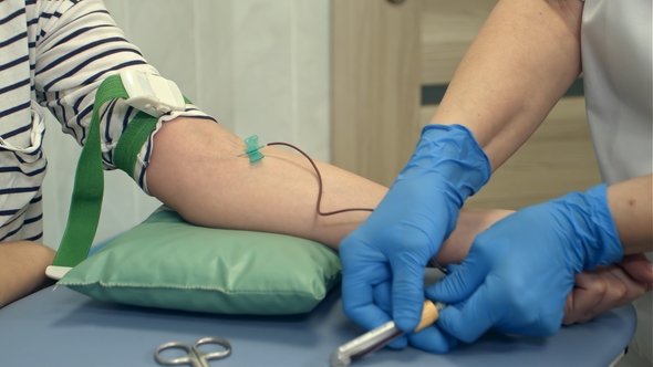 Female Donor Giving Blood