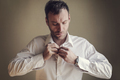 Man fastening his shirt - PhotoDune Item for Sale