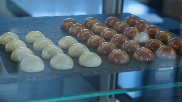 Chocolate and White Chocolate Candies in Shop Window
